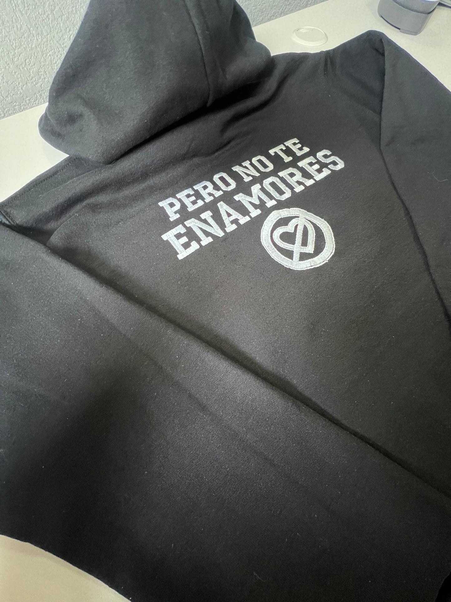 Pero No Te Enamores Embroidery Hoodie. Fuerza Regida. Front and back