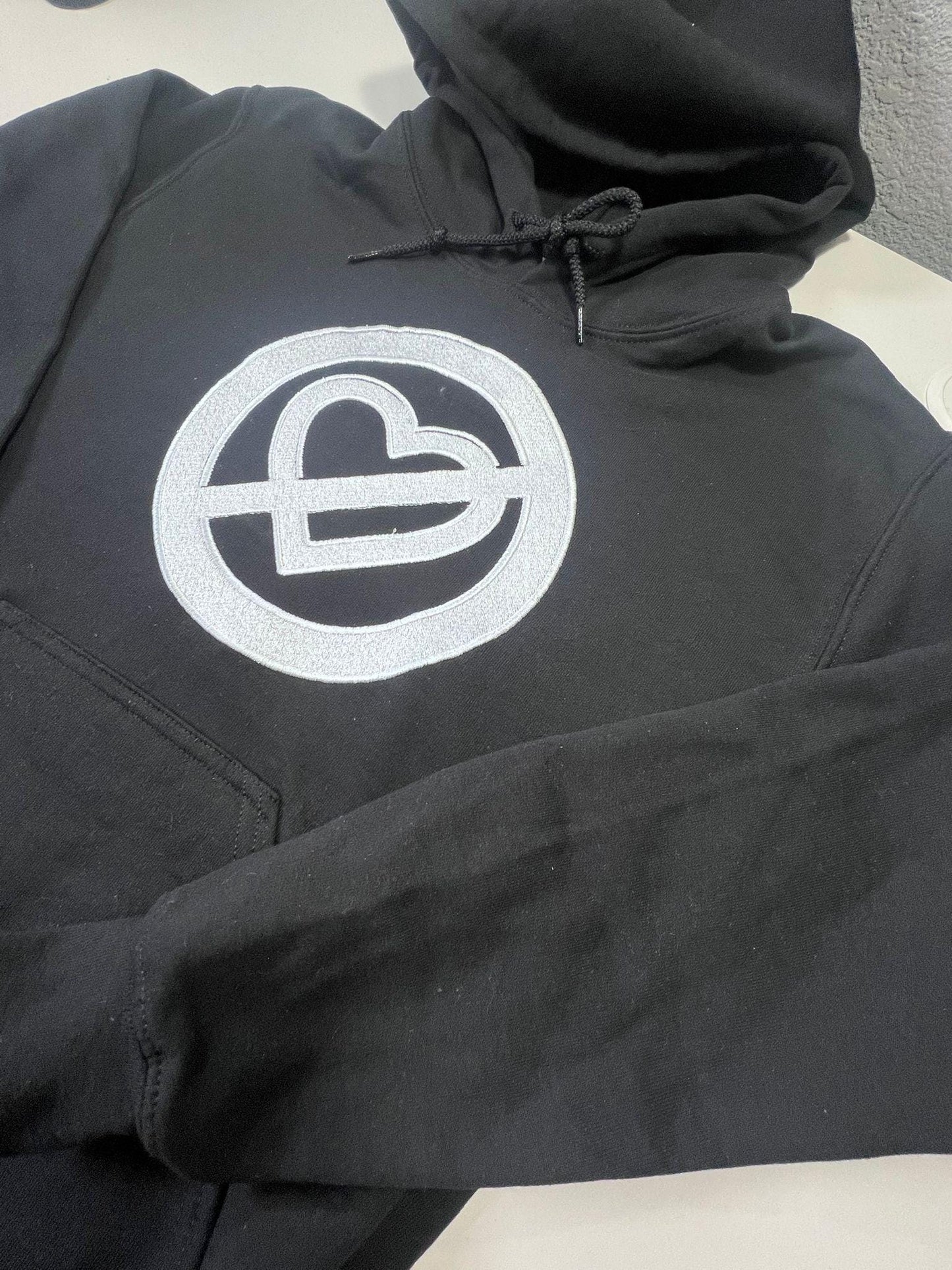 Pero No Te Enamores Embroidery Hoodie. Fuerza Regida. Front and back